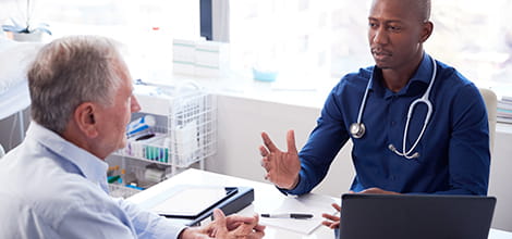 GP consulting with patient